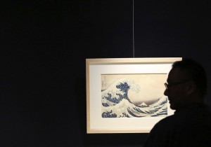 In this Nov. 18, 2016 photo, a visitor photographs "The Great Wave off Kanagawa," Katsushika Hokusai