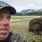 Photographer-takes-a-selfie-with-a-Grizzly-bear-near-a-salmon-spawning-stream-K0c5c1ad51a9cba35